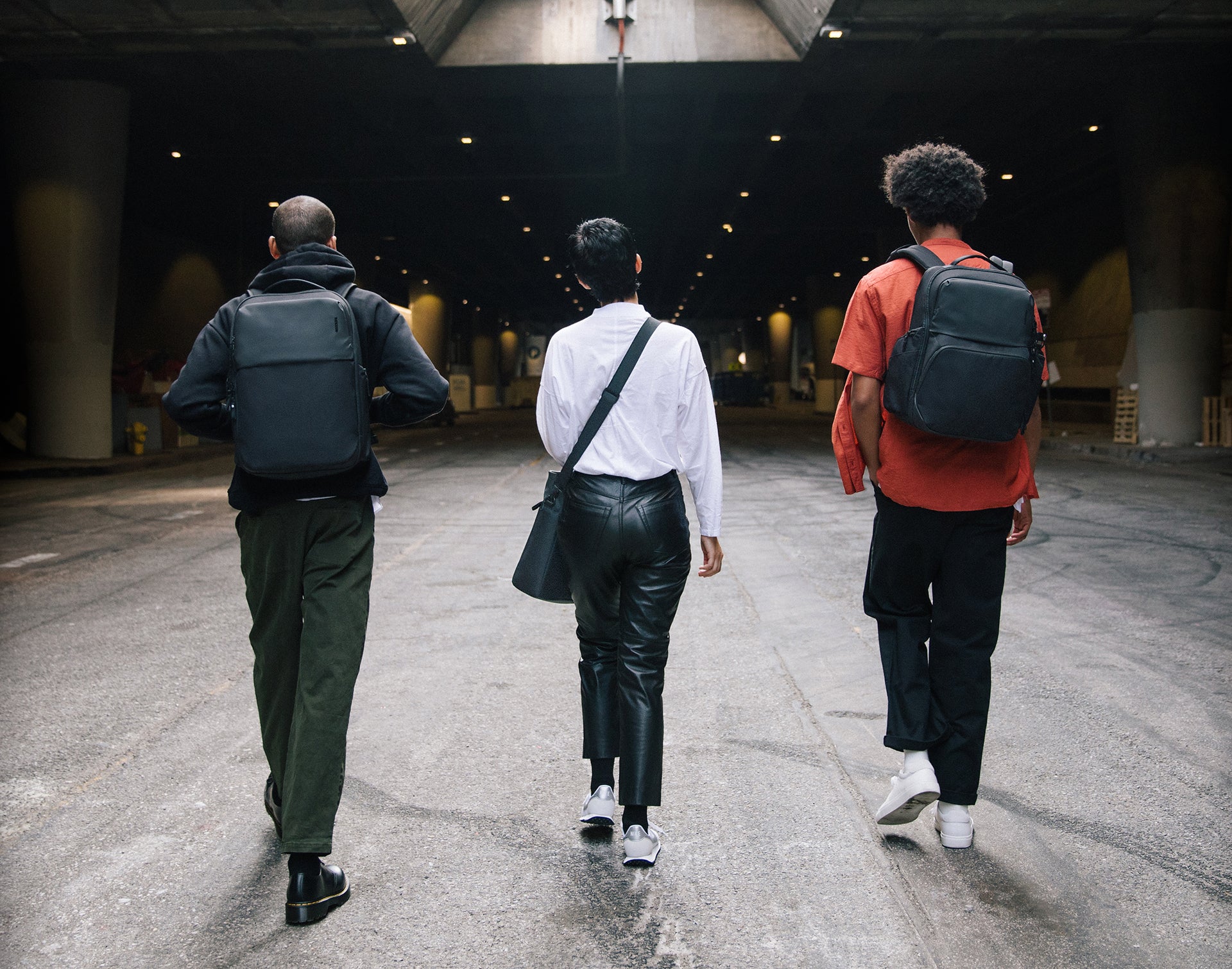 Large spread photo of 3 people wearing the A.R.C. collection in NYC